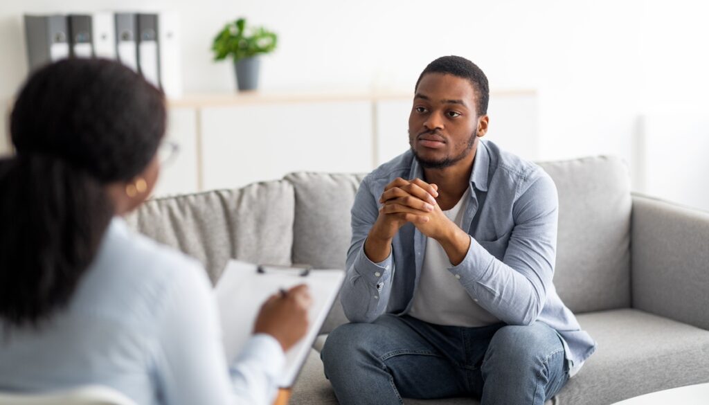 Black man in an individual therapy session. Showcasing how important mental health care is for minorities in Texas.